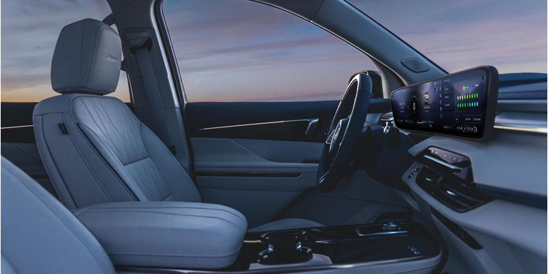 2026 Buick Enclave interior showing three-row seating and premium finishes
