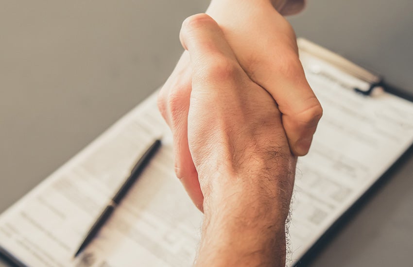 Trade-in appraisal handshake for a used Buick Envista at Cable Dahmer Buick GMC of Independence